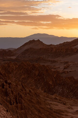 Scenic view of Atacama Desert with sandy dunes and rough rocks on sunny day in Chile
