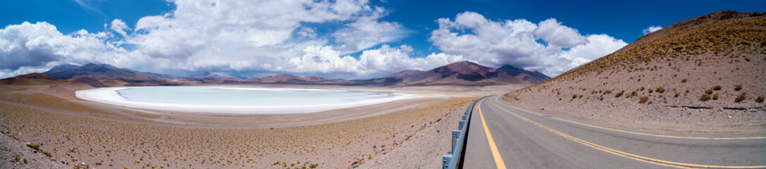 Scenic panoramic view of empty asphalt road going through Atacama Desert on sunny day in Chile