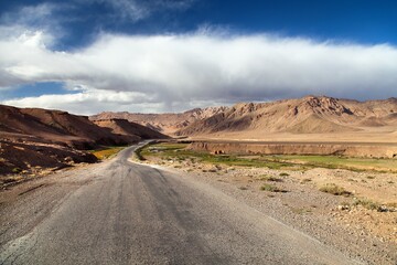 Fototapeta na wymiar Pamir highway road in Tajikistan mountain landsscape