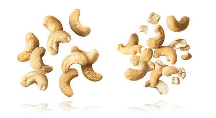 Fotobehang fresh cashew nut falling in the air © Agave Studio