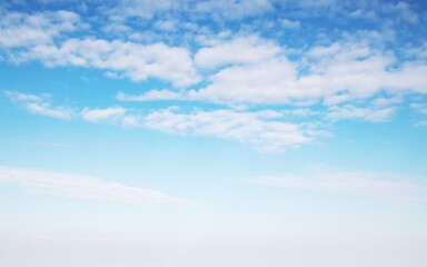 White altocumulus clouds are in blue sky at daytime