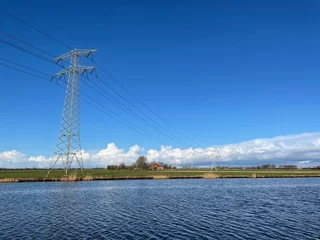Fotobehang Power line next to the Prinses Margriet canal © TravelTelly