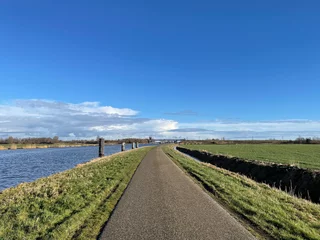 Fotobehang Road next to the Prinses Margriet canal in Friesland © TravelTelly