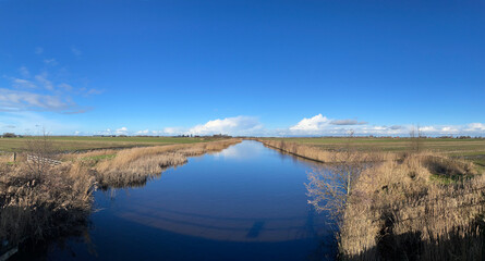Panorama from a canal on a winter day around Broek