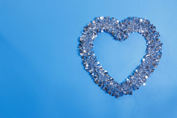 A heart shaped ornament on a blue background