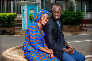 adult business couple sitting on the street.