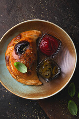 Calzone pizza with sauce and hot pepper