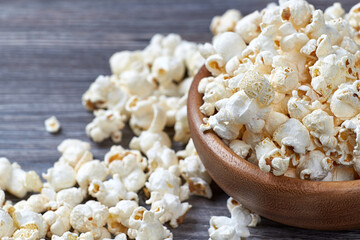Closeup of a lot of popcorn in a wooden bowl