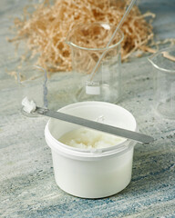 Plastic jar with coconut cream for preparation of cosmetic products