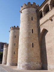 Fototapeta na wymiar Enormous palace in european Saragossa city at Aragon district in Spain, clear blue sky in 2019 warm sunny summer day on September - vertical.