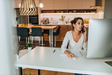 Kitchen in the background, busy woman.