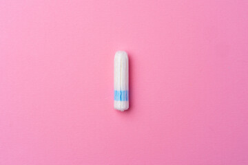 Hygienic female tampon on a pink background