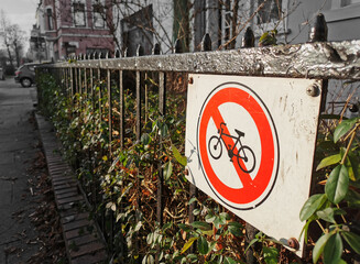 Red-White warning sign with pictogram, no bike parking, bicycle prohibited or not allowed...