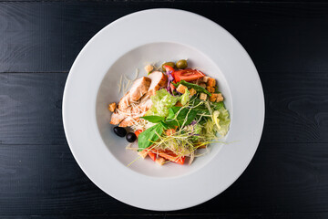 Healthy organic Chicken Caesar Salad with grilled chicken on plate