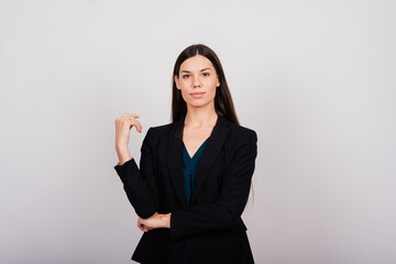 Obraz premium Portrait of a happy beautiful smiling woman touching her face isolated
