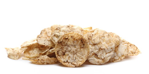 Rice crisps, chips pile with sea salt and black pepper isolated on white background