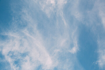 beautiful clear blue sky with white streaks 
