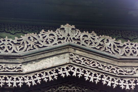 Russia, Tver region. 07.18.2020: Kalyazin district. Porechye. Old wooden house in the Art Nouveau style of the estate of the Vinogradov brothers. Detail of a window decorative carved platband.