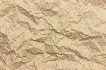 The texture of crumpled brown craft paper.