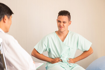 Midsection Of Doctor Examining Patient At Hospital