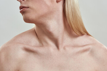 Naklejka premium Collarbone of young naked man with head turned to side