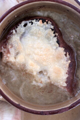 onions soup with hot cheese and toast bread as french cuisine food