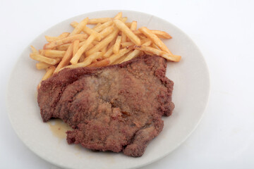 veal breaded meat with fried potatoes