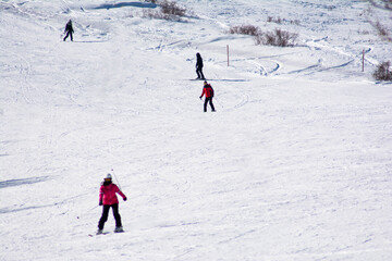 Snowboarder goes down the mountain. Skier goes skiing. Winter sports. Skiers descend from the...
