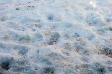 background with frozen snow in a street