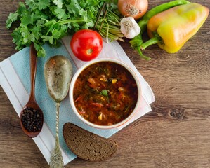 Bowl of traditional soup Borscht on table