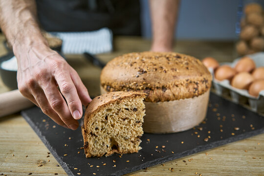 Healthy and nutritious breakfast or snack with a slice of homemade cereal sweet bread. The baked cake is made from flour, eggs, cereals, oats, spelled, barley and chocolate.