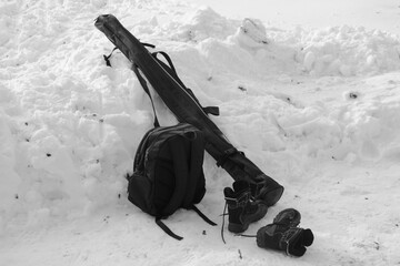 Ski bag, ski boots and backpack on snow background, winter skiing equipment