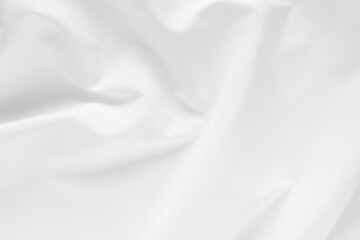 Obraz premium Abstract white fabric texture background. Cloth soft wave. Creases of satin. silk and cotton.