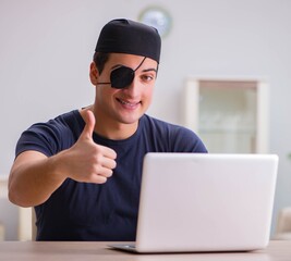 Digital security concept with pirate at computer