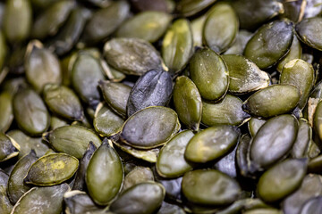 A full frame photograph of green pumpking seeds