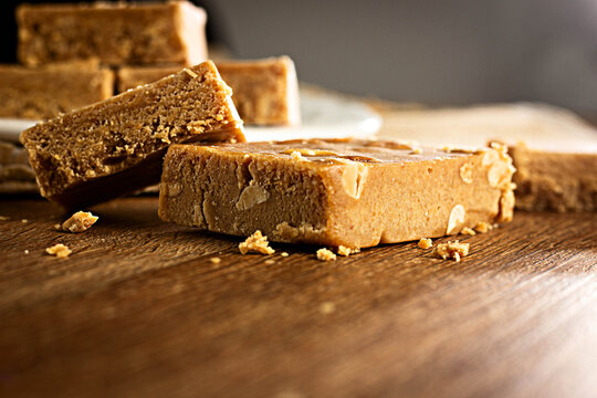 Pa&ccedil;oca, Brazilian Typical Peanut Candy on Wooden Table and a Plate