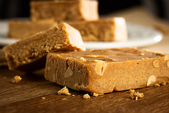 Pa&ccedil;oca, Closeup,  Brazilian Typical Peanut Candy on Wooden Table and a Plate