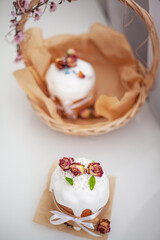 Traditional russian easter cake on table. The decorarion of kulich are the flower are eating on spring holiday