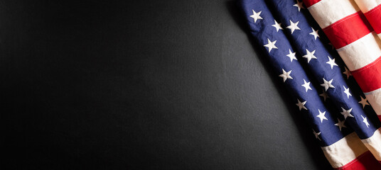 Happy presidents day concept with flag of the United States on black wooden background.