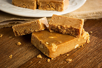 Paçoca, Closeup,  Brazilian Typical Peanut Candy on Wooden Table and a Plate