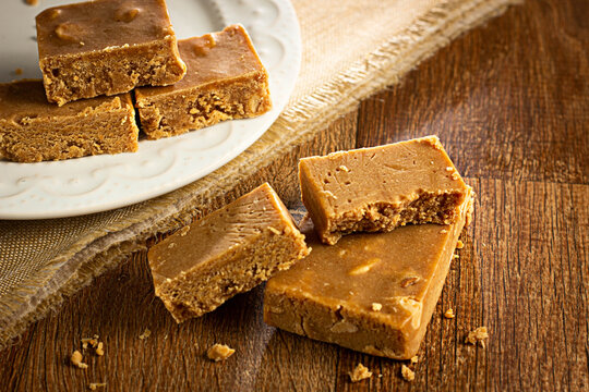 Pa&ccedil;oca, Brazilian Typical Peanut Candy on Wooden Table and a Plate