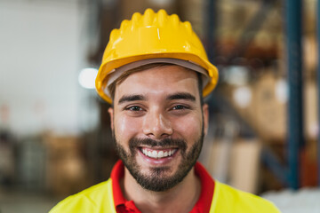 Portrait of happy young man working in delivery warehouse - Logistic and industry concept