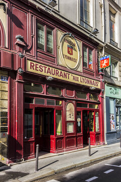 View "Aux Lyonnais" with original sign "Maison Lyonnaise": a Parisian bistro dedicated to cuisine of Lyon. This traditional "Bouchon Lyonnais" in Paris opened in 1890. PARIS, FRANCE. June 26, 2017.