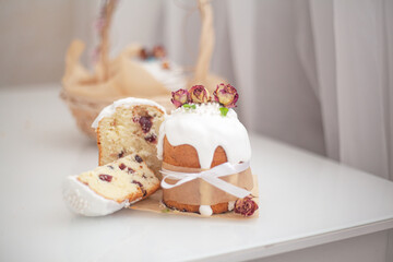 Traditional russian easter bread on table. The decorarion of kulich are the flower are eating on spring holiday