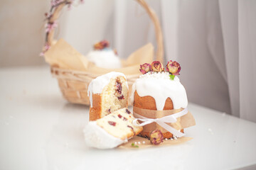 Traditional russian easter bread on table. The decorarion of kulich are the flower are eating on spring holiday