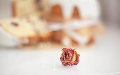Traditional russian easter bread on table. The decorarion of kulich are the flower are eating on spring holiday