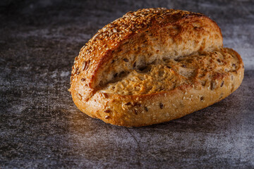 Assortment of baked bread on wooden table background Fresh fragrant bread on the table. Food concept.