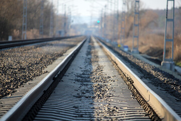 Fototapeta premium Close up and selective focus photo of railway tracks with green free signal