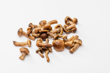 salted mushrooms mushrooms, scattering on a white background, close-up