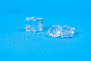One whole drink ice cube and a broken ice cube